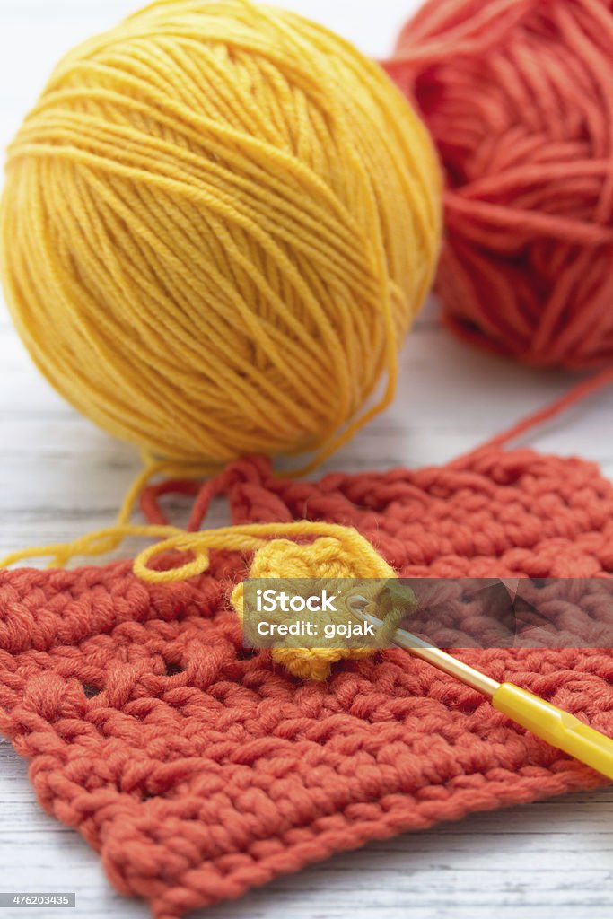 hook Yellow and orange yarn with crochet hook Crochet Hook Stock Photo