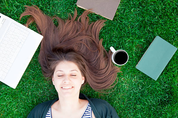 istock student girl with laptop computer and books 476203520