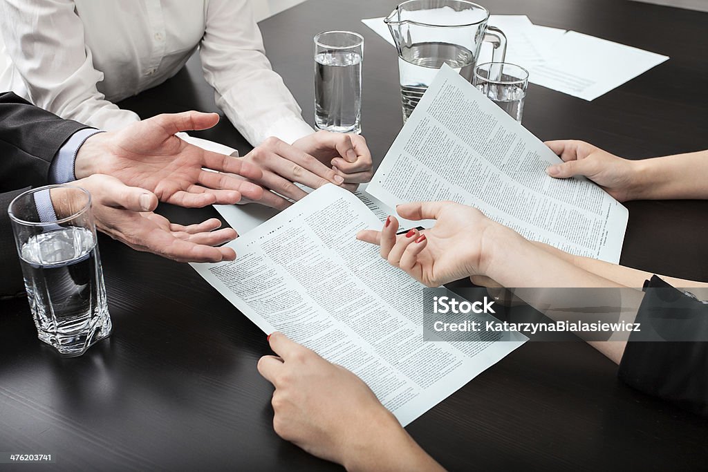 Business people Closeup of four business people at the meeting Adult Stock Photo