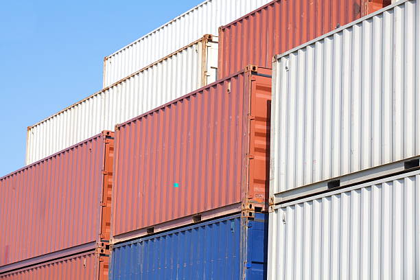 istock Stacked cargo containers in freight sea port terminal 476206431