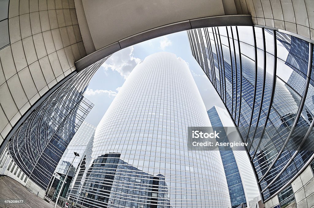 Modern architecture in the business district of La Defense Large skyscrapers shot with a fisheye lens La Defense major business district near Paris, France Abstract Stock Photo