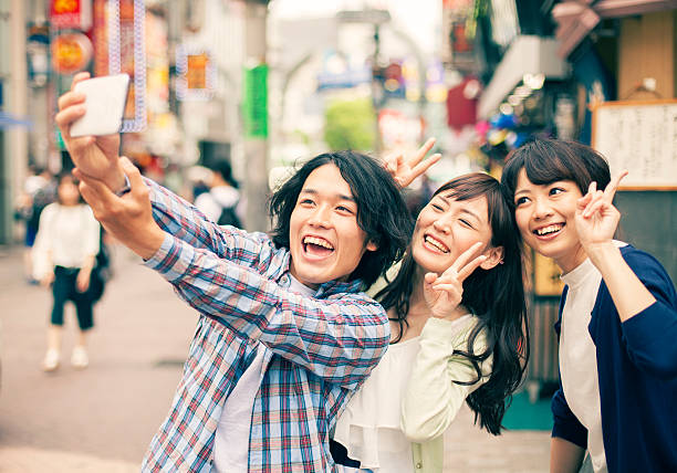 istock Young asian people taking selfie 476208492