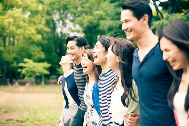 istock Young people  walking in park 476208494