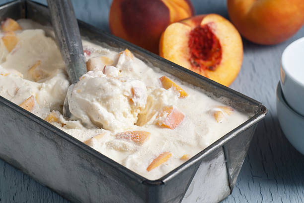 Homemade Peach Ice Cream Homemade peach ice cream. homemade icecream stock pictures, royalty-free photos & images