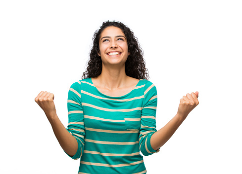 Cheerful woman making fist isolated over white background