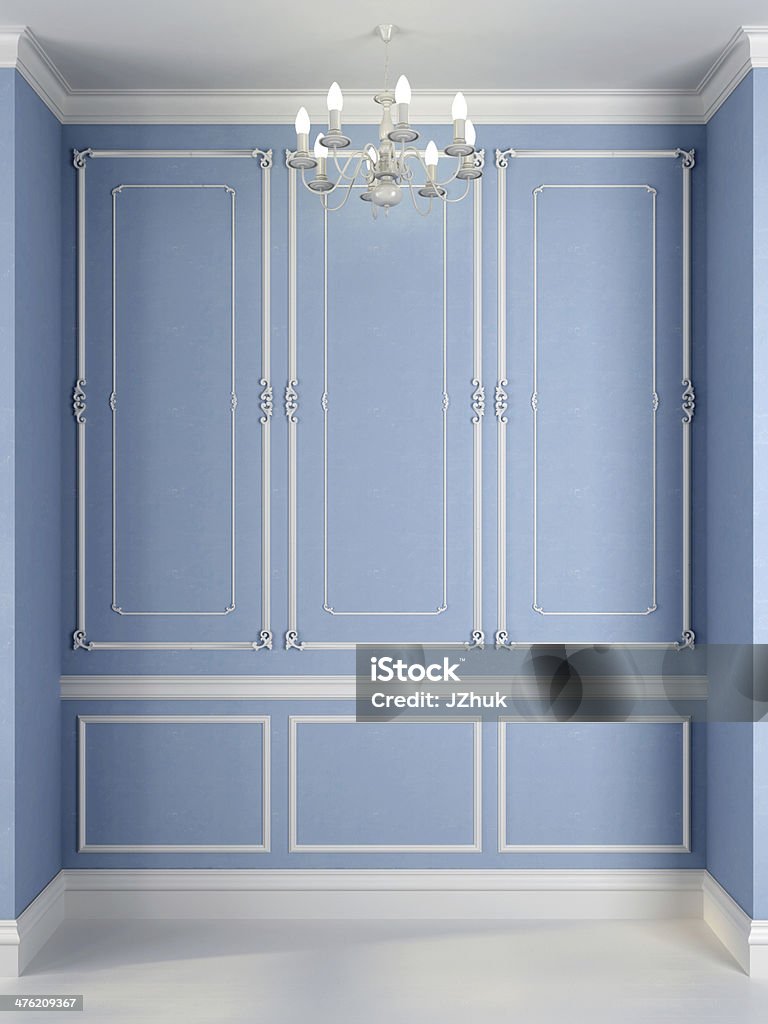 Blue wall with a white decor Classical interior of a blue wall and a white decor Chandelier Stock Photo