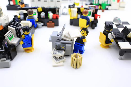 Hong Kong, Сhina - March 25, 2015:  Studio shot of Lego people in office, combine from different set. Legos are a popular line of plastic construction toys manufactured by The Lego Group in Denmark