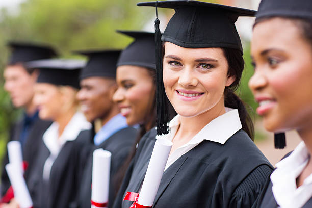 istock female college graduate at graduation 476209851
