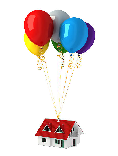istock Group of multicolor balloons, lifting up a house. 476211129