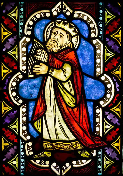 Colourful medieval stained glass window depicting King David made by an unknown author
