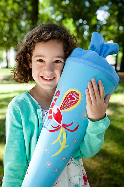 proud first grader with schultüte (or zuckertüte) proud girl with schultüte (or zuckertüte) zuckertüte stock pictures, royalty-free photos & images