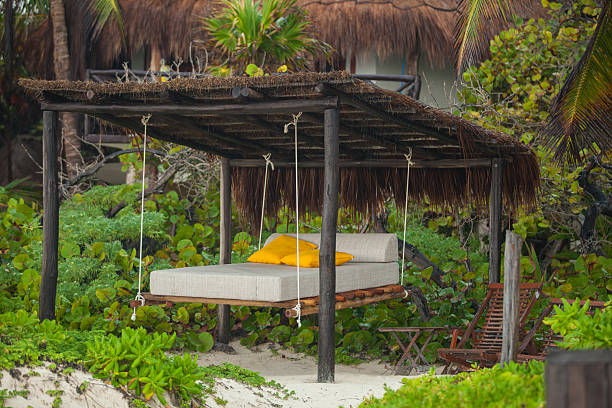 istock Beach beds among the trees at tropical exotic white plage 476213259