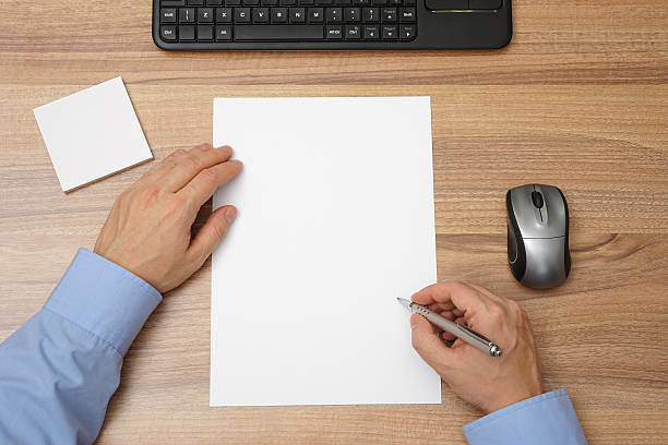 istock Businessman  with blank paper and pen in hand ,begin with writing 476213400