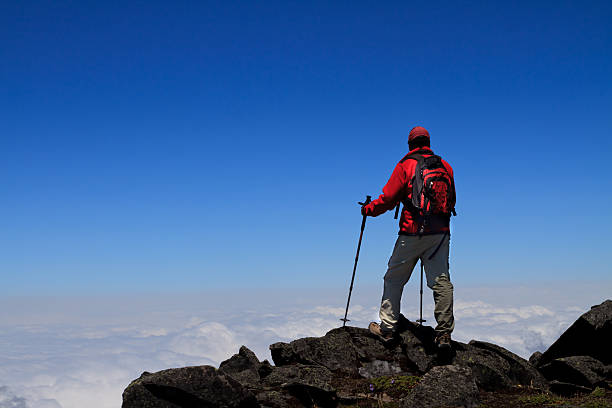 istock Man on peak of mountain. 476213455