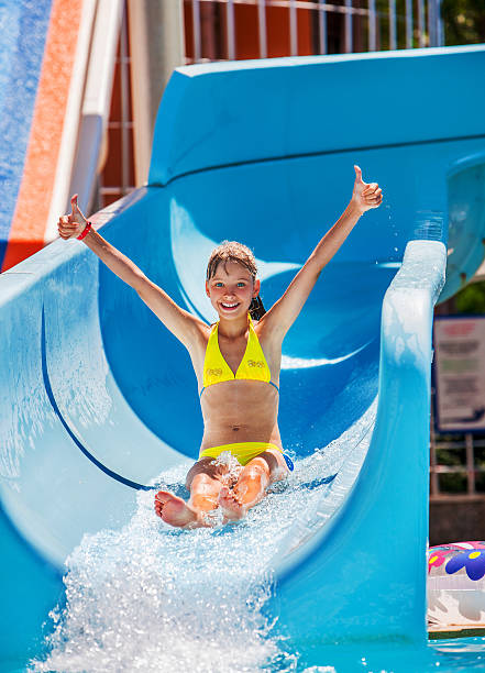 Child on water slide at aquapark