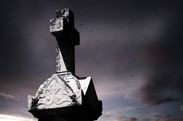 istock Old cross tombstone, moody sky background 476215845