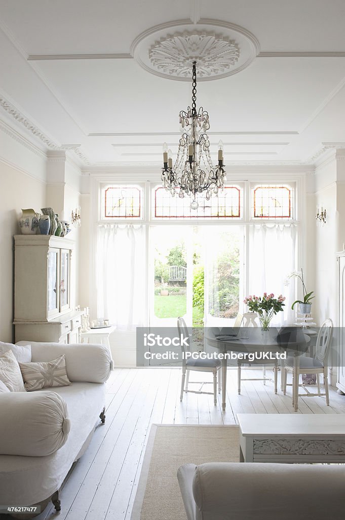 Living Room With Sofa; Table; Chairs And Chandelier Interior of living room with sofa; table; chairs and chandelier Cozy Stock Photo