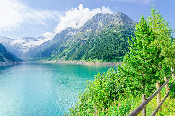 istock Azure mountain lake and high Alpine peaks, Austria 476218542
