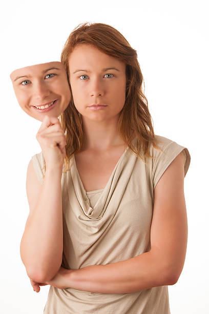 istock Woman hiding under the happy mask. 476218699