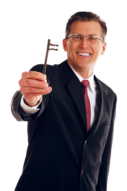 istock Business Man Holding a Antique Skeleton Key 476218862