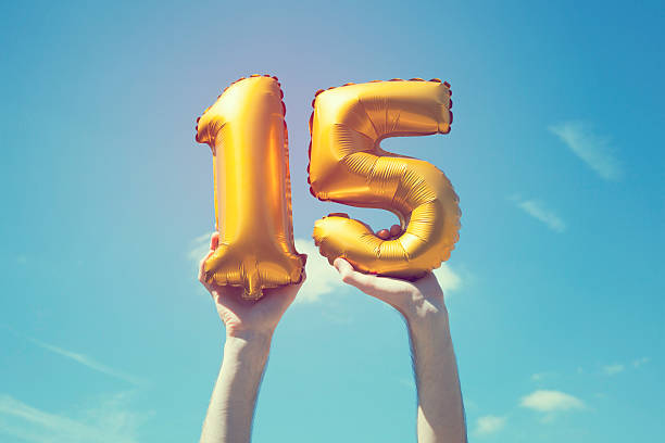 Gold number 15 balloon stock photo