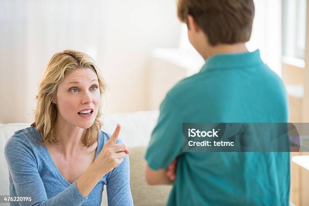 Angry Mother Scolding Son At Home Stock Photo - Download Image Now - Mother, Son, Scolding