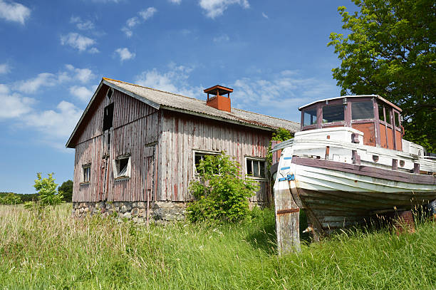 Abandoned barn with boat stock photo