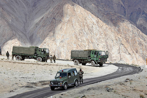 Indian army convoy of trucks Jammu & Kashmir, India - September 4, 2011: Indian army convoy of trucks delivering supplies to remote military installations in Himalayas military deployment photos stock pictures, royalty-free photos & images