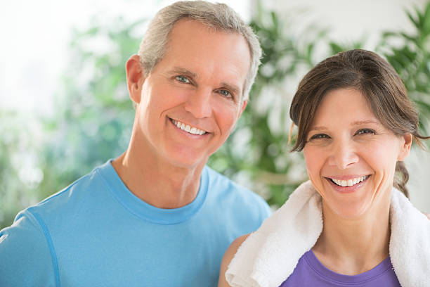 istock Fit Couple Smiling Outdoors 476220295