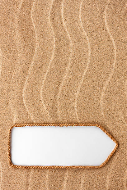 istock Pointer made of rope on the sand 476222362
