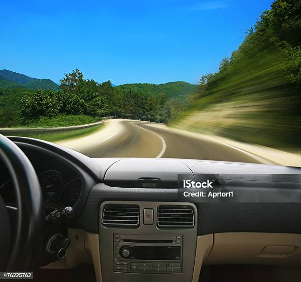 Car Going On The Mountain Road Stock Photo - Download Image Now - 2015, Asphalt, Blurred Motion