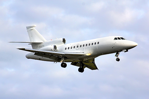 Berlin, Germany - August 17, 2014: French Air Force Dassault Falcon 900 arrives at the Tegel International Airport.