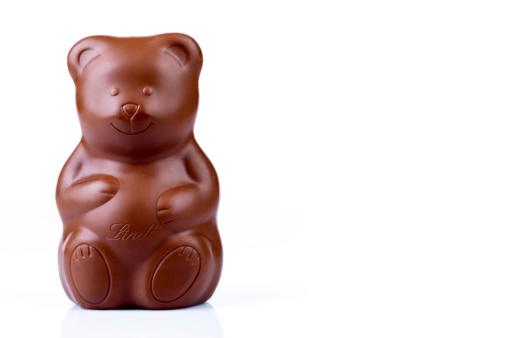 Rome, Italy - February 25, 2014:  Photo of a Lindt Milk Chocolate Bear, product that is part of the hollow bodies of Lindt chocolate which makes 32% to 54% of the Italian market share on Easter and Christmas.