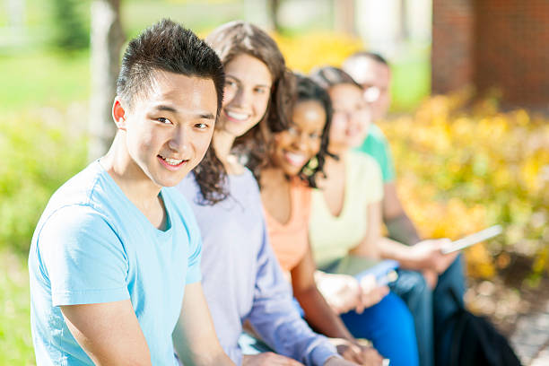 学生 - multi ethnic group outdoors 20s student ストックフォトと画像