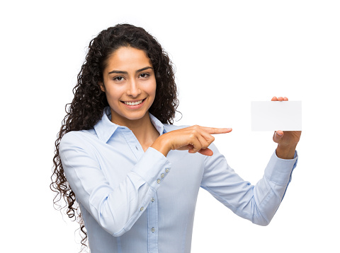 Close-up of a businesswoman showing an empty business card and smiling isolated over white background