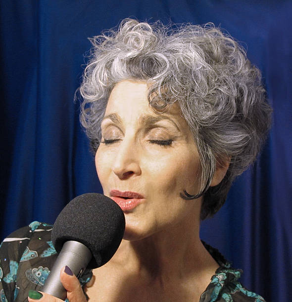 istock Woman singing, eyes closed 476228819