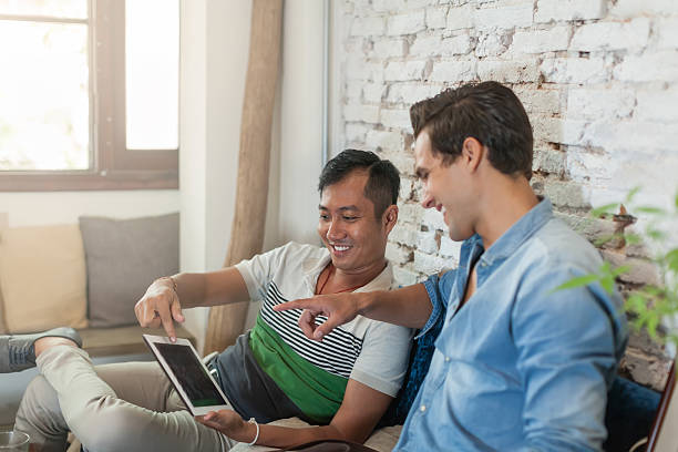 istock Two Men Using Laptop at Cafe, Multiethnic Friends Guys Sitting 476229830