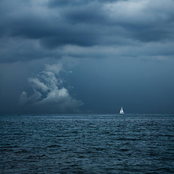Boat Sailing in Center of Storm Formation stock photo