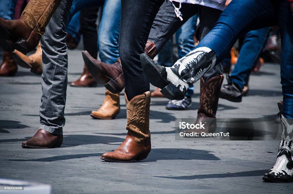 Cowboy Boots Line dancing photo just of the boots in an urban setting. Dancing Stock Photo