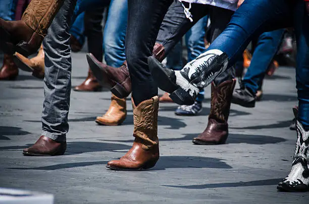 Line dancing photo just of the boots in an urban setting.