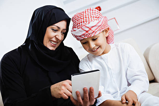 istock Happy Arabic child at home with his mother 476232617