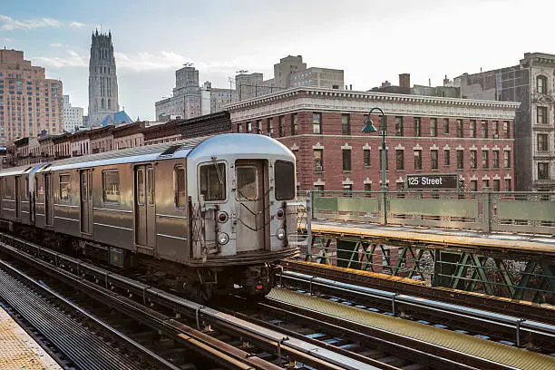 Photo of Train Approaching  Elevated Subway Station in Harlem, New York