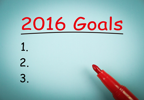 2016 Goals is on blue paper with a red marker aside.