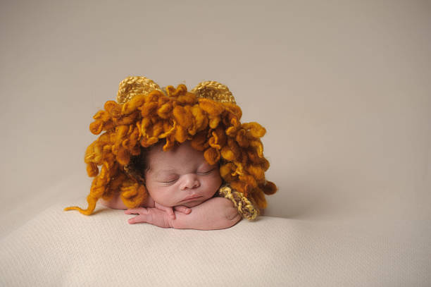 Cute two year old girl with lovely curly hair looking up.