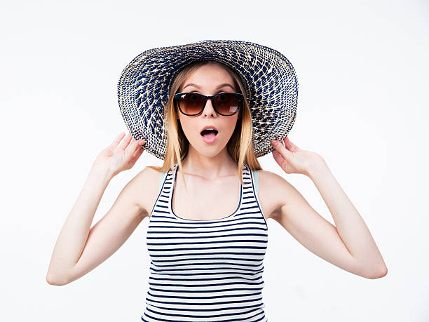 istock Amazed young woman in hat and sunglasses 476235100