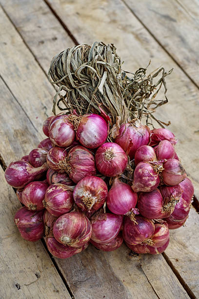 istock Shallot onoins on wood 476239520