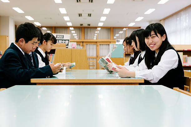 istock Japanese high school, study group in the school library, reading 476239638