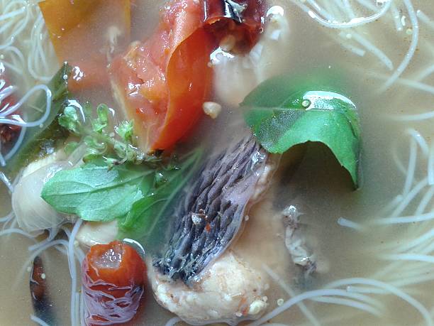 istock Fish soup put herbs and vermicelli 476240064