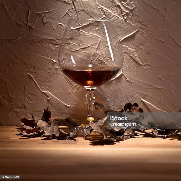 Brandy And Dried Oak Leaves Stock Photo - Download Image Now - Alcohol - Drink, Amber, Bar - Drink Establishment