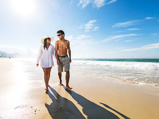 istock Young loving couple walking on the beach and communicating. 476241496